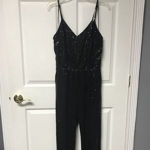 Black sequin jumpsuit; size large, never worn